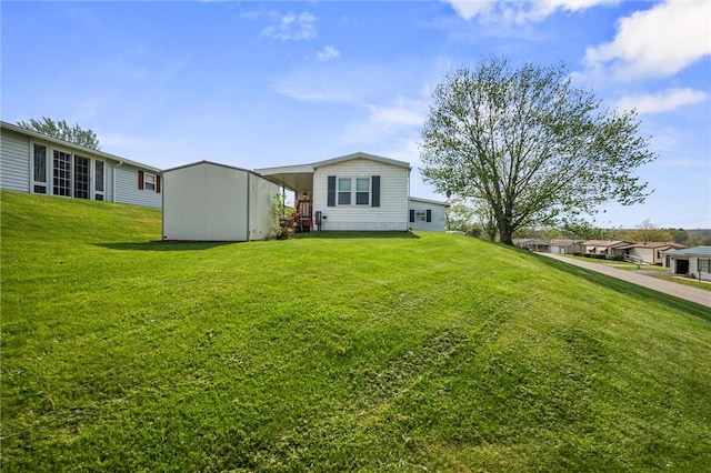 rear view of house with a lawn
