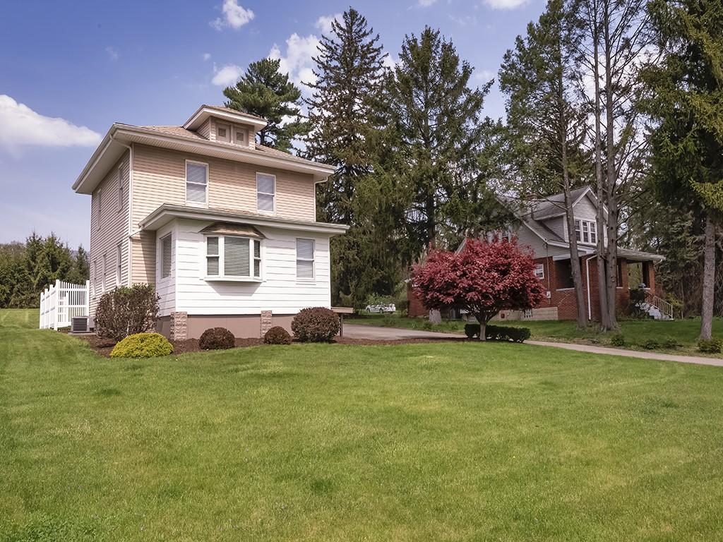 9151 Peebles Rd, Mccandless, PA 15101 - view of side of home with a yard and central AC unit