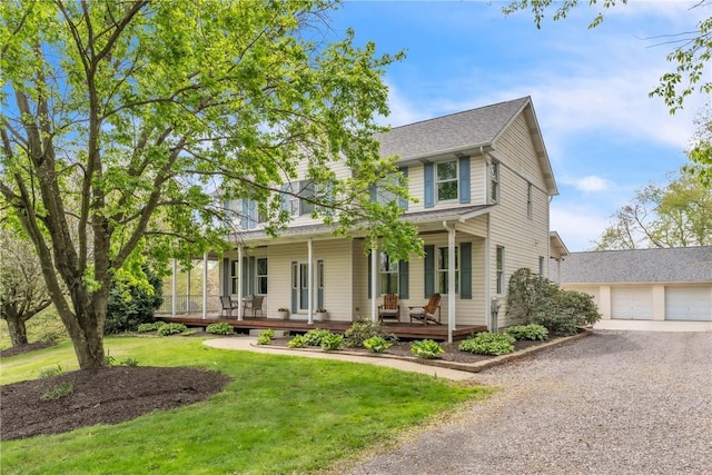 6181 Brown Rd, Penn Twp, PA 16002 - view of front of house featuring a porch, gravel driveway, a front yard, a garage, and a shingled roof