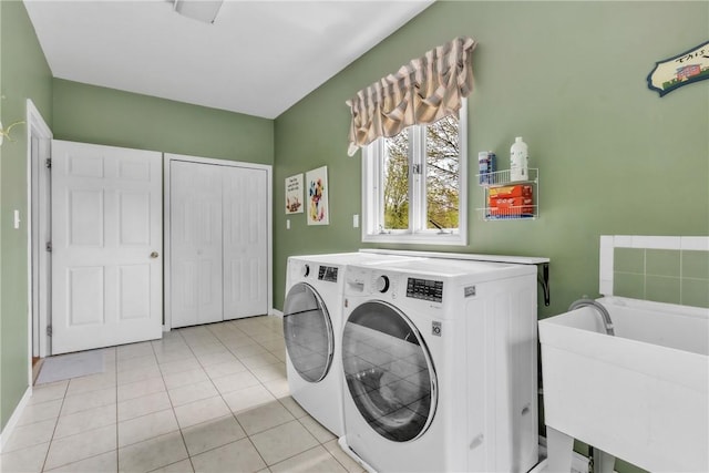 6181 Brown Rd, Penn Twp, PA 16002 - washroom with washing machine and clothes dryer and light tile patterned flooring