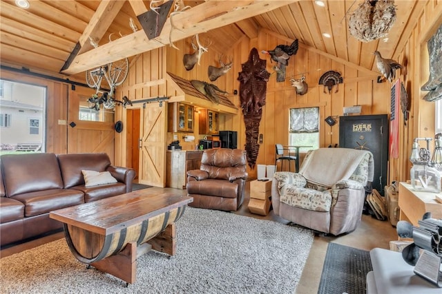 6181 Brown Rd, Penn Twp, PA 16002 - living area with a barn door, a wood ceiling with exposed beams, wood walls, and high vaulted ceiling