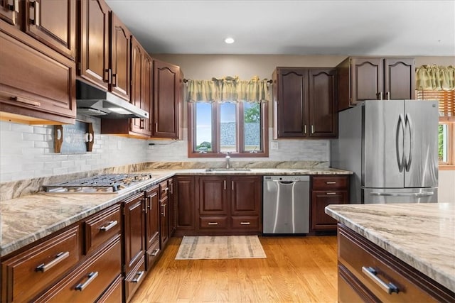 6181 Brown Rd, Penn Twp, PA 16002 - kitchen featuring stainless steel appliances, under cabinet range hood, plenty of natural light, light stone counters, and recessed lighting