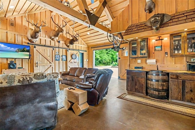 6181 Brown Rd, Penn Twp, PA 16002 - living room featuring finished concrete floors, wood walls, high vaulted ceiling, wooden ceiling, and a barn door