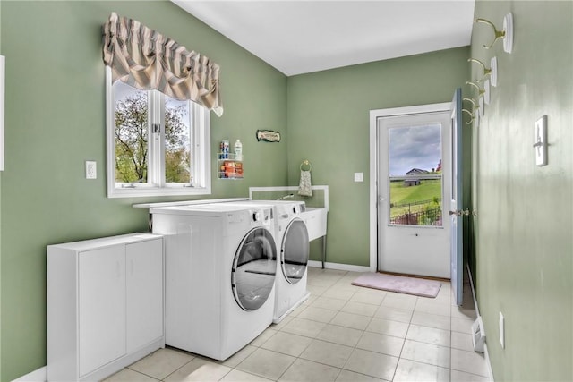 6181 Brown Rd, Penn Twp, PA 16002 - laundry area featuring separate washer and dryer, plenty of natural light, and light tile patterned flooring