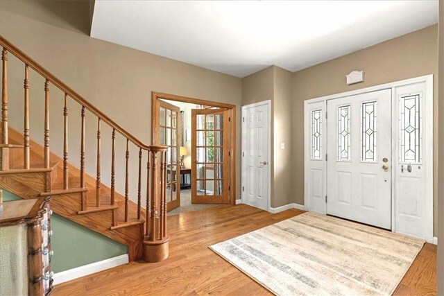 6181 Brown Rd, Penn Twp, PA 16002 - entrance foyer featuring light wood finished floors and stairs