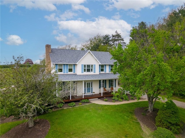 6181 Brown Rd, Penn Twp, PA 16002 - country-style home featuring a porch, a front lawn, a chimney, and roof with shingles