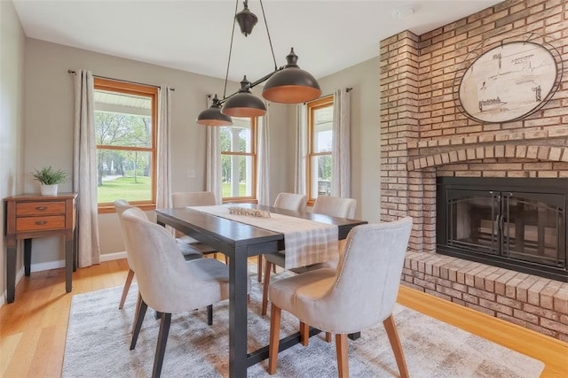 6181 Brown Rd, Penn Twp, PA 16002 - dining room featuring wood finished floors and a brick fireplace