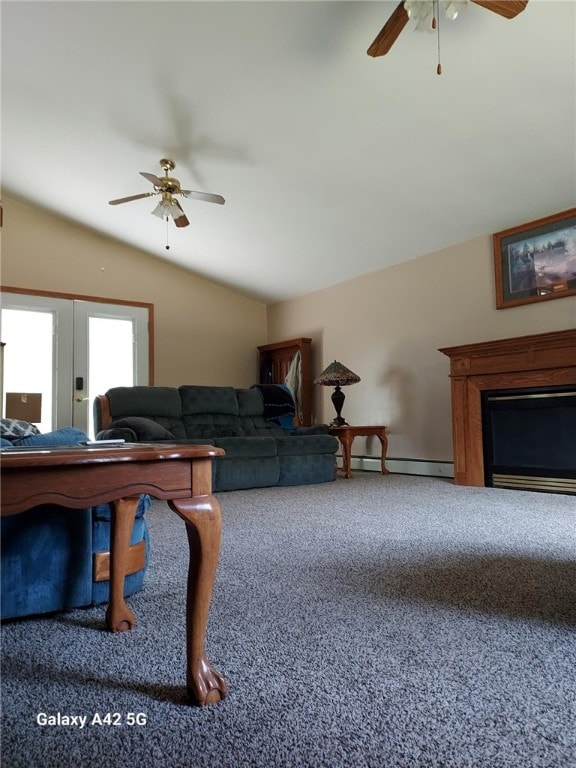 living room featuring ceiling fan, a fireplace, baseboard heating, lofted ceiling, and carpet flooring