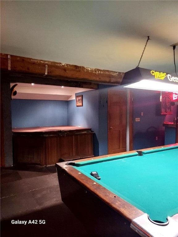 recreation room with beamed ceiling, billiards, and a bar
