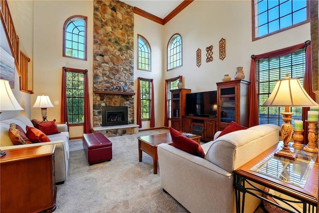 living room with crown molding, a towering ceiling, and a wealth of natural light