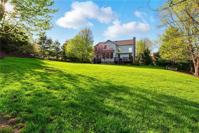 view of yard with a deck