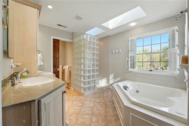 full bathroom with a skylight, crown molding, a tub with jets, and visible vents