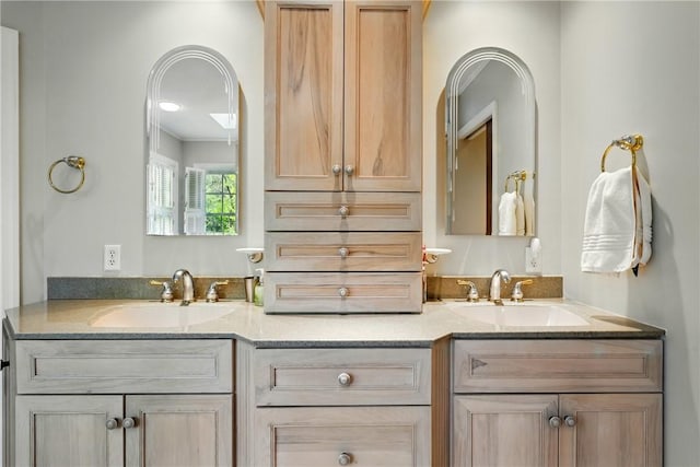 bathroom with double vanity and a sink