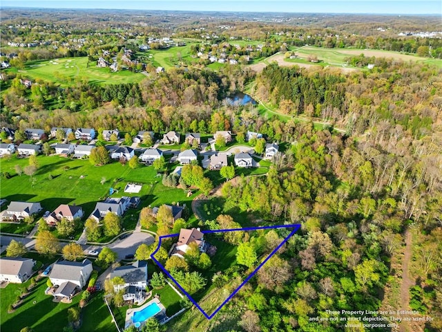 bird's eye view with view of golf course and a residential view