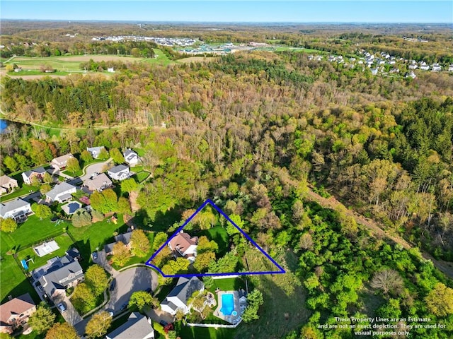 aerial view with a residential view and a wooded view