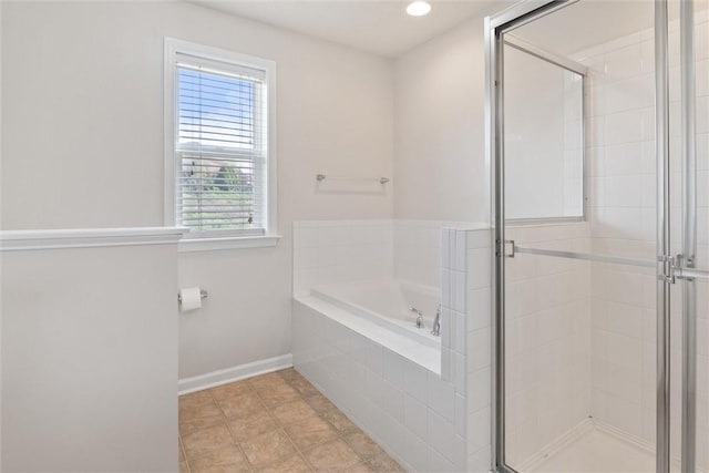 bathroom with a garden tub, a stall shower, baseboards, tile patterned floors, and recessed lighting