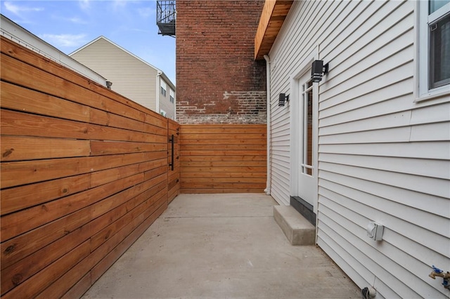view of property exterior featuring fence