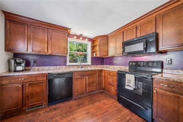 kitchen with visible vents, open shelves, dark wood finished floors, a sink, and black appliances