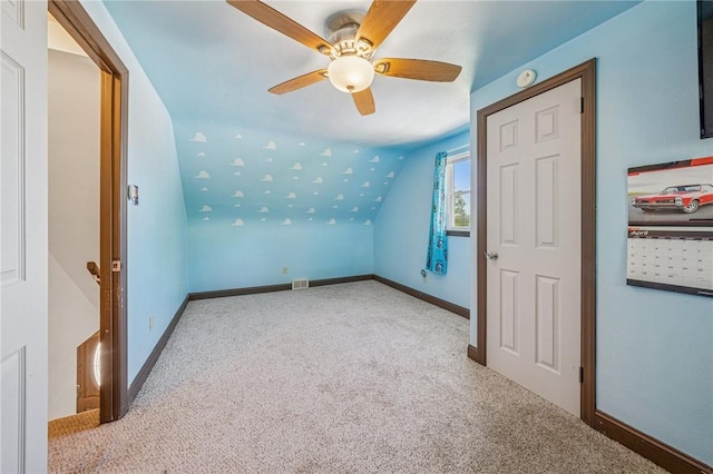 bonus room with baseboards, ceiling fan, carpet, and vaulted ceiling