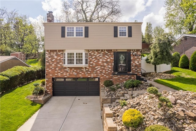 colonial-style house with brick siding, an attached garage, a chimney, and concrete driveway