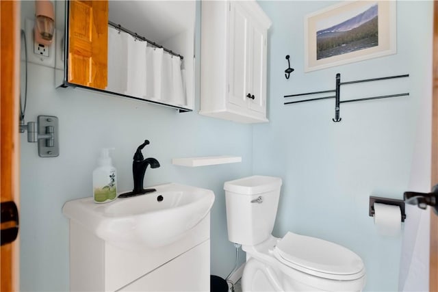 bathroom with vanity and toilet