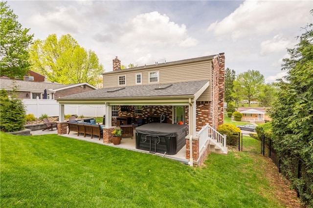 rear view of house with a patio, a fenced backyard, outdoor lounge area, and a chimney