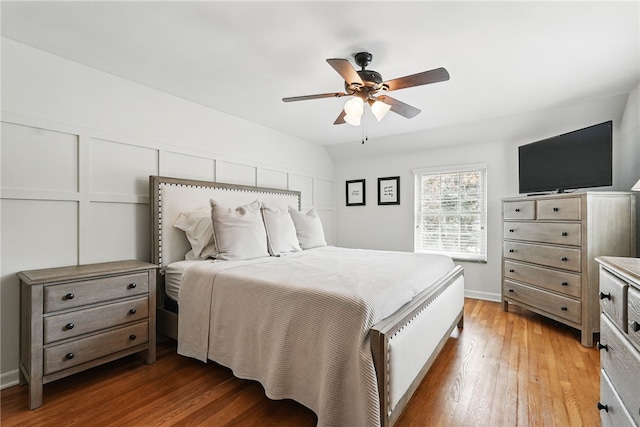 bedroom featuring baseboards, a ceiling fan, and light wood-type flooring