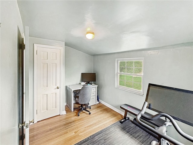 office space featuring light wood-type flooring and baseboards