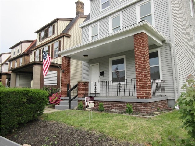 724 Maplewood Ave, Ambridge, PA 15003 - view of front of home featuring a porch and brick siding