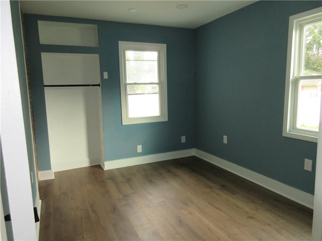 724 Maplewood Ave, Ambridge, PA 15003 - unfurnished bedroom featuring dark wood-style flooring and baseboards