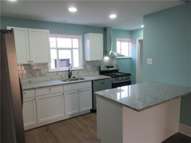 724 Maplewood Ave, Ambridge, PA 15003 - kitchen featuring a sink, wall chimney exhaust hood, stainless steel appliances, dark wood finished floors, and tasteful backsplash