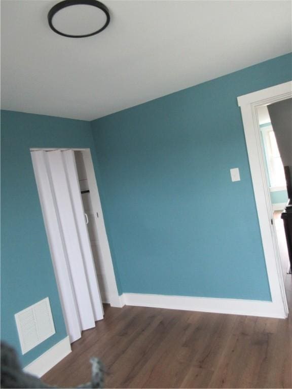 724 Maplewood Ave, Ambridge, PA 15003 - empty room with baseboards and dark wood-type flooring