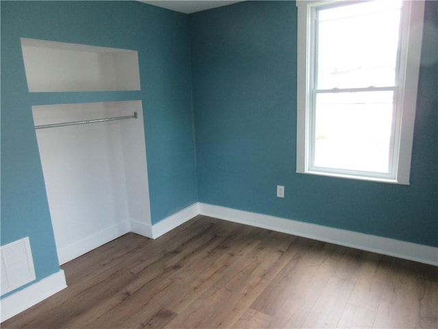 724 Maplewood Ave, Ambridge, PA 15003 - unfurnished bedroom featuring dark wood-style floors and baseboards