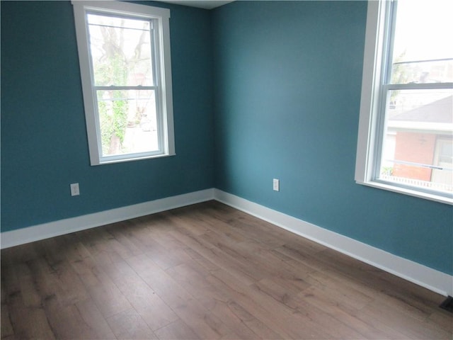 724 Maplewood Ave, Ambridge, PA 15003 - empty room with wood finished floors and baseboards