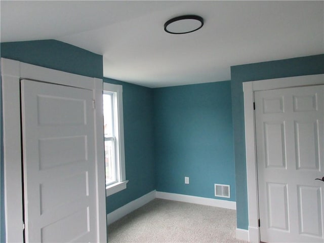 724 Maplewood Ave, Ambridge, PA 15003 - unfurnished bedroom featuring baseboards, light carpet, and vaulted ceiling