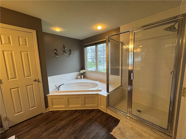 2001 Trillium Ct, North Strabane, PA 15317 - full bath featuring wood finished floors, a bath, and a stall shower