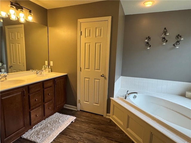 2001 Trillium Ct, North Strabane, PA 15317 - bathroom with a garden tub, a sink, wood finished floors, and double vanity