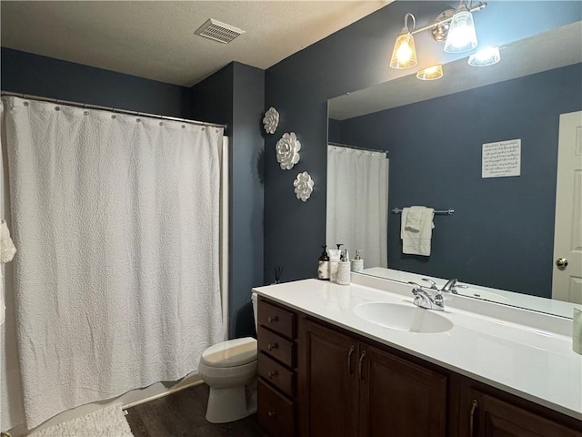 2001 Trillium Ct, North Strabane, PA 15317 - bathroom featuring visible vents, a shower with curtain, toilet, and vanity