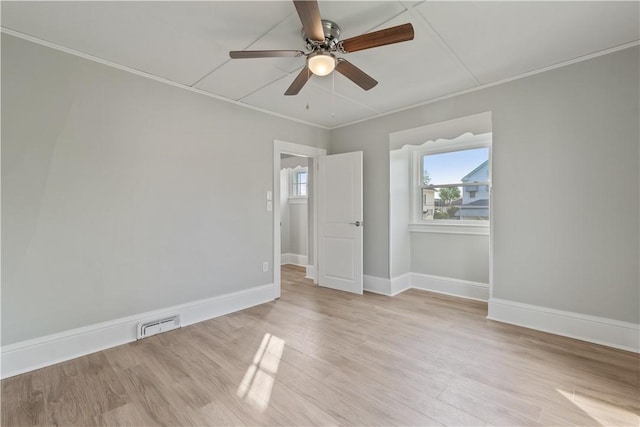 848 Ohio Ave, Monaca, PA 15061 - empty room featuring ceiling fan, visible vents, crown molding, baseboards, and light wood-style flooring