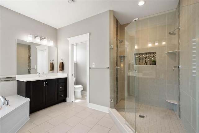 full bathroom featuring a shower stall, vanity, tile patterned floors, toilet, and recessed lighting