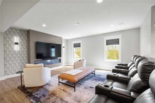living room with recessed lighting, baseboards, and wood finished floors