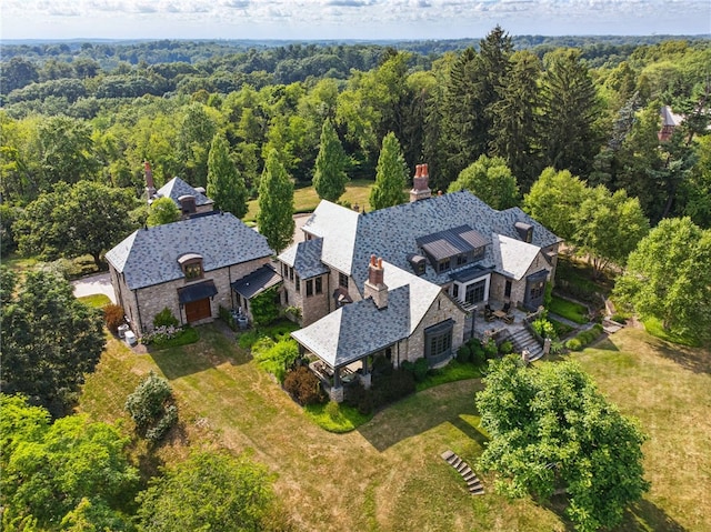 drone / aerial view featuring a view of trees
