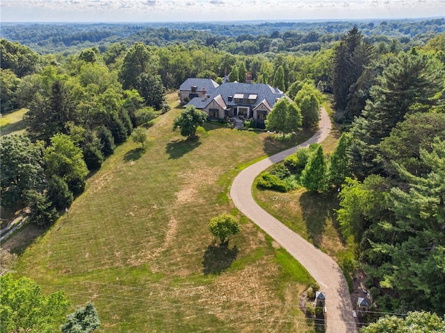 aerial view with a wooded view