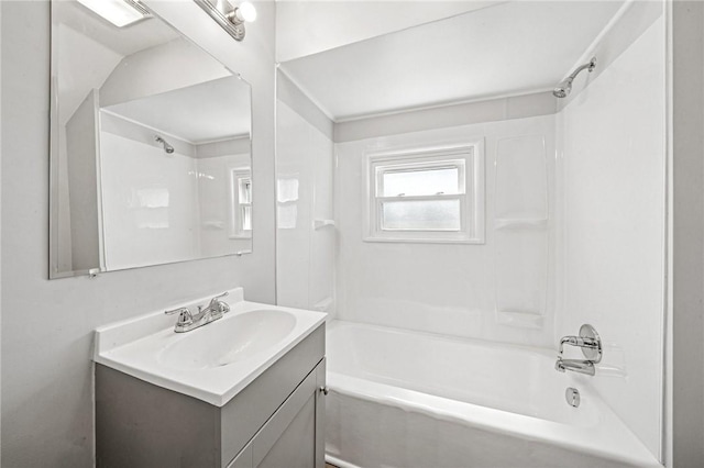 full bathroom featuring washtub / shower combination and vanity