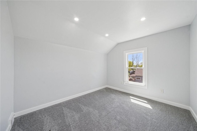 additional living space with baseboards, carpet flooring, recessed lighting, and lofted ceiling