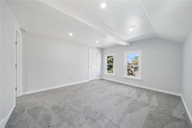 interior space with carpet flooring, recessed lighting, baseboards, and lofted ceiling