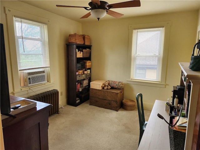 home office with a healthy amount of sunlight, radiator, cooling unit, and light colored carpet