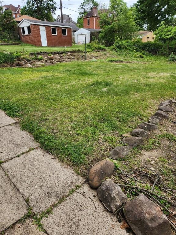 205 Bon Air Ave, Bon Air, PA 15210 - view of grassy yard featuring an outbuilding and a garage