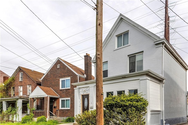 view of front of home with brick siding