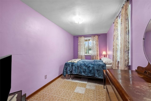 bedroom featuring baseboards